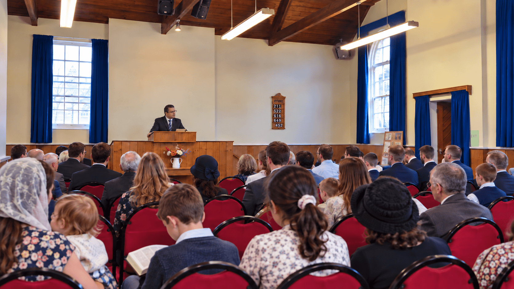 A preacher addressing the congregation during a service at Providence Baptist Chapel