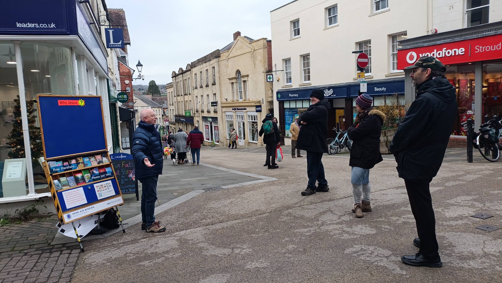 Open-air outreach stand and literature